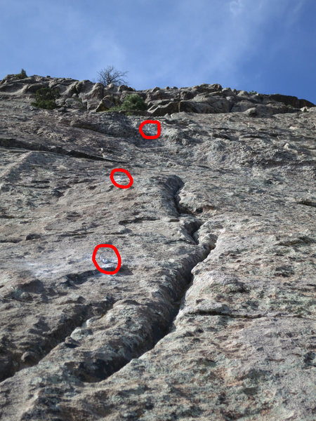 Looking up at pitch 3. New bolts circled in red. The crack next to the first bolt takes a bomber tricam. A few feet above the second bolt is a horizontal crack that takes an excellent Alien or equivalent.