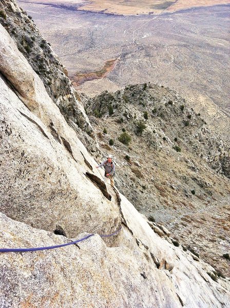 Climber following "crux" traverse of pitch 5.