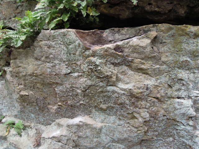 Starting holds near the bottom of the picture, next handhold is big edge right beneath the large horizontal crack