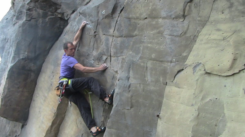 French climber Simon Flechaire pulling through the crux