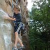 Rhys Schreck (age 9) negotiating the beginning moves of 5.10c above Classic Crack.