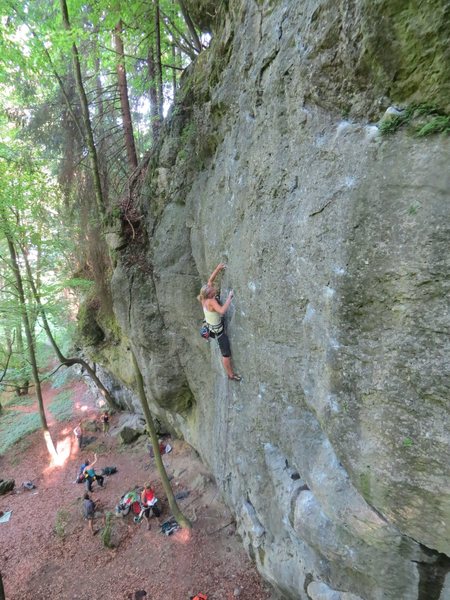 A nice view of nearly the whole crag. This climber is on Dr. Snape, which is route 14 of 20. The route Voldemort is also visible on the right side.