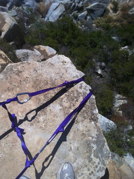 Webbing anchor set up for top rope. Recommend using 7mm cord there are sharp corners on the anchor boulders. 