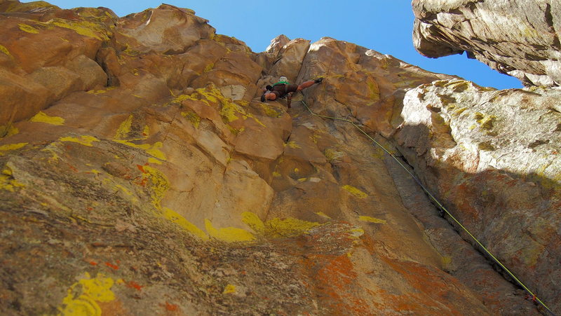 Mooner leading through the beginning of the crux.