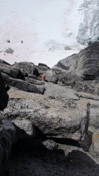 Surf's Up - west face of Snowpatch Spire. Looking down on the famous Surf's Up ledge from the pitch 5 belay. Bugaboo Glacier is  a couple thousand feet below.    7/25/13