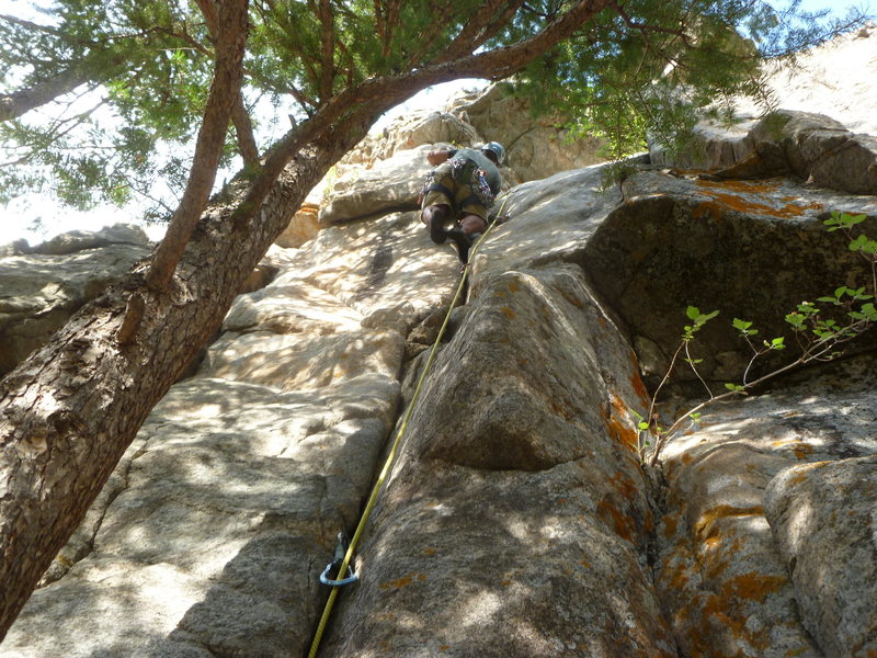 At the bolts above the crack.