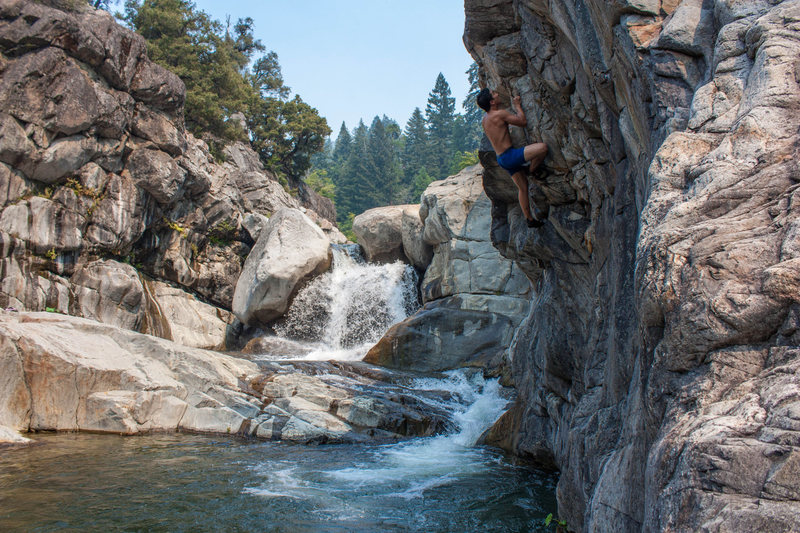 Deep water soloing on a great boulder problem at the Emeralds. Probably a V1. Great holds and fun movement with a safe and deep landing (always test the water before DWS or cliff jumping).<br>
<br>
For those curious on how to get to this swimming hole /problem:<br>
<br>
Take the trail across the road from the parking lot downstream along the river for about 1/3 mile. You will see the first swimming hole pictured above on your left. Scramble down the third class terrain to get to it. There are additional places to jump as you go down river.