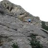 The skyline ridge is the South Arete.  Tyler rappelling down the first pitch.