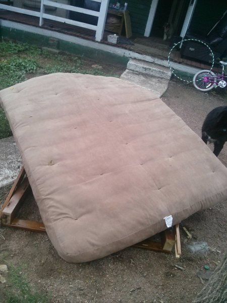 Mattress with old wooden loft kit underneath.