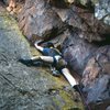 George Bracksieck leading into the first crux of "Quiche on a Leash," in March, 1978. Notice the absence of a chalkbag. No-trace climbing meant no chalk, despite my oily skin.