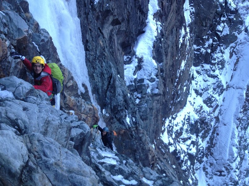 Now that the sun has set, it's a bit safer to climb under the huge mass of the last pitch.