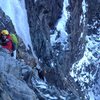 Now that the sun has set, it's a bit safer to climb under the huge mass of the last pitch.