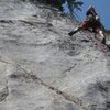 Approaching the crux shallow groove on the first ascent of Little Gem.