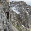 The easy but exposed traverse on pitch 2 of via della Guida.