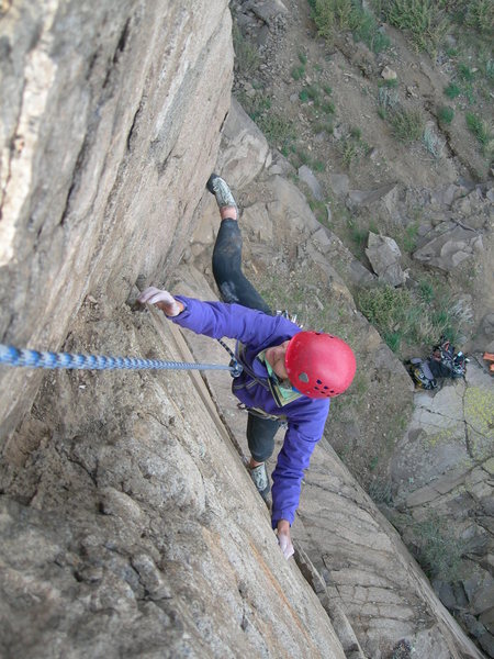 Deb reaches for the top of the dihedral's useful holds.