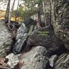 This photo shows how to locate 'Bejesus' from just uphill of 'Patton's Arete'. (Just uphill of the other photo I submitted as well.) The location of the 'Bejesus' boulder is shown in the photo. 'Brother John' is located on the same boulder to the right of 'Bejesus' in a little cave.