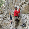 Belizean adventure guide Ian Burns leading Stout Undertaking (5.5) at the CAT Wall at Indian Creek (04-2013).