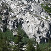 Overview of the Wild Rose Buttress as seen from South Lake Road. Rose Gardening (aka Blackwater) goes up the sun and shade arete on the right side of the cliff to the right of a large chimney/corner. 