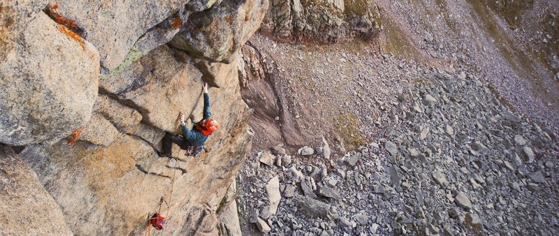 Clipping the bolt in the middle of the crux on pitch 6. This is a video still shot by Kyle Berkompas for the film Exposure Volume 1 produced by Chuck Fryberger Films.