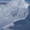 Skiing the North Face of Rime Peak with Ahtna Peak in the background.