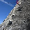 Looking up the second pitch. It's run-out with one chickenhead to sling. Then a bolt protects the crux before gear can be placed again. 