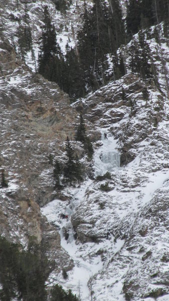 The upper section of Three Tiers with some climbers on the route.