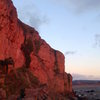 Brean in the evening light. A climber having one last go on Storm Warning Variation (5.13a/b)