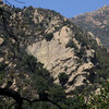 Just downhill and across the stream from Renaissance Crag is giant cliff band that is home to the historic route "Fun in the Sun" by Forkash and Anderson. <br>
<br>
To get to the Fun in the Sun Wall, follow a climber's trail up the obvious gully on the left, which is reached 50 yards before the stream crossing where Renassaince Crag is located. The first three routes that are reached along the trail are Pilot's Paradise (5.9), Cupcakes & Champage (5.9+) and Labrador Cupcakes (5.6).