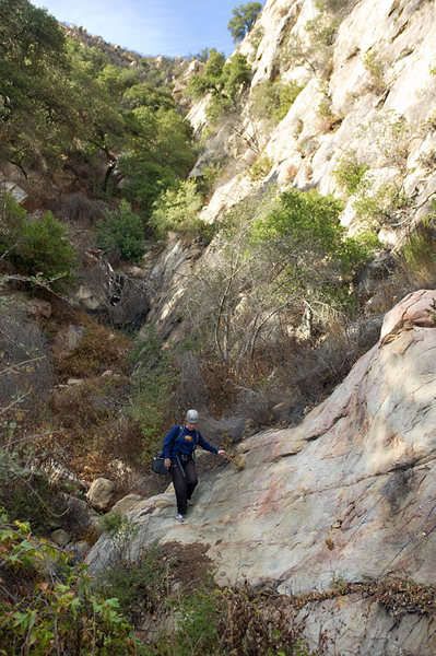 Nicole descends the gully below the Fun in the Sun wall.