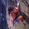 Skip Guerin barefoot on the Alien Roof (5.12b), Yosemite Valley<br>
<br>
Photo by Steve Morris