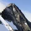 Upper portion of the North Ridge and Forbidden's summit as veiwed from the Col. The Northwest face variation is the prominent snow feature leading up to the ridge. 