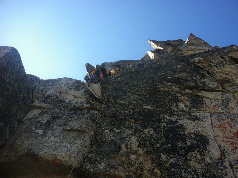 mid way up the route, mark leads through the choss pile pitch.