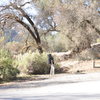 John pointing towards the approach trail from the parking lot.