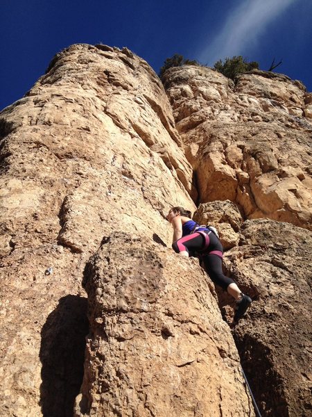 Meaghan ascends the right side of the small pillar. 