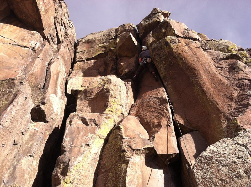 Chimney Route is the crack in the corner on the left, Hand Crack has a climber on it, on the right.