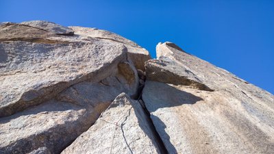 Start of the real south crack route from the sun deck boulder. 