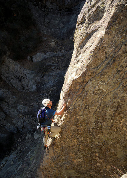 Roland Geyer climbs through the lengthy crux sequence of Snickerdoodle, at the Fortress.