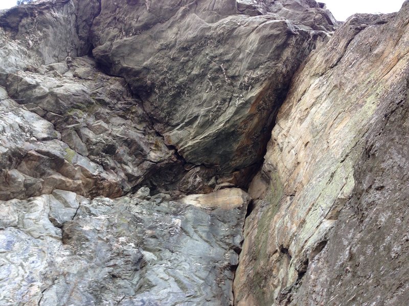 Looking up at Zombie Woof (left-trending crack) and Doan's Pills (right-trending crack) from the belay. Climb the corner then choose your adventure! I believe the chimney starts at the dark spot where the left-trending crack turns upwards. 