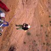 Chip jumaring on pitch 5. A storm rolled across from the La Sals, with lightning and much wind.