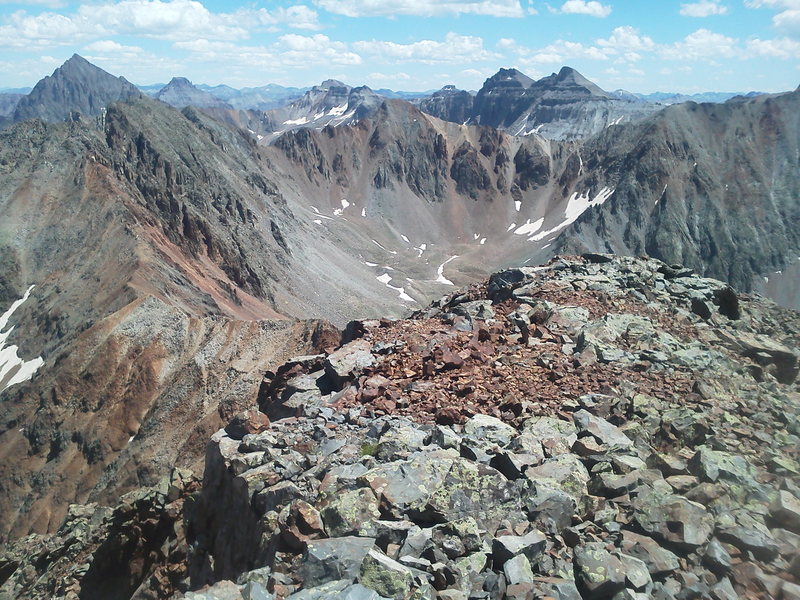 From Mears looking southeast back along the ridge line. S6 and S5 on the ridgeline left, S3 center.  T.O. out of sight on the far right. Sneffels looming large back left, Dallas and West Dallas back center.