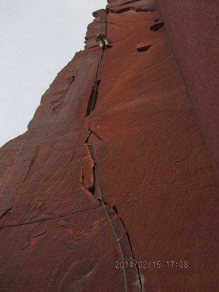 almost to the top... who ever went to the right off the ledge has no clue how to find a route? but has plenty of time to  scratch in "no anchors" on more then one rock on top of pitch one  