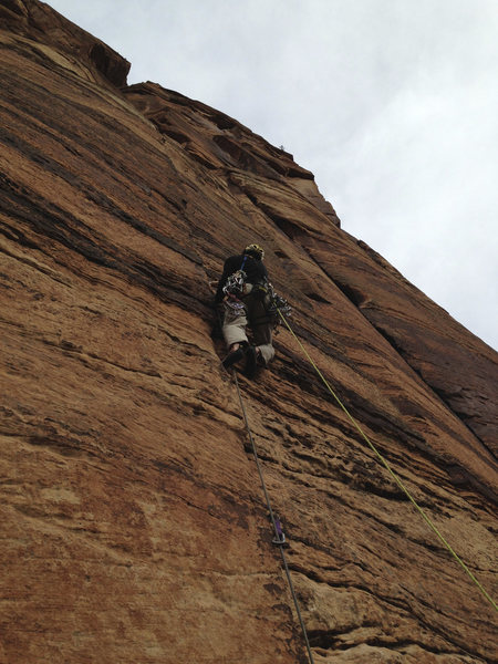 Climbing pitch one of Tricks of the Trade.