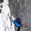 Making the delicate traverse to belay anchors on top of the 2nd pitch.