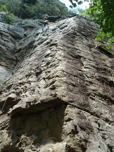 Ankles Away (5.9+) on the face to the left, Twist and Shout (5.9+) on the arete.