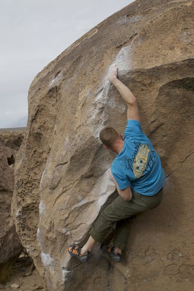 Luke Lydiard sticking the slap on The Clapper, Happy Boulders, Bishop, CA.