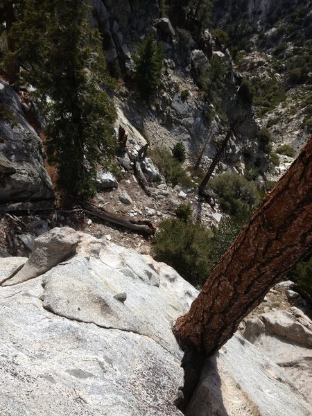 Looking down from the belay ledge. You could take the first pitch longer and belay in a cave thing under a boulder, but a semi hanging belay with this view is way sicker. 