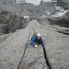 David Barnett feels some earned exposure with the final hand cracks above the Lotus headwall; SE Face of Lotus Flower Tower. 8/07