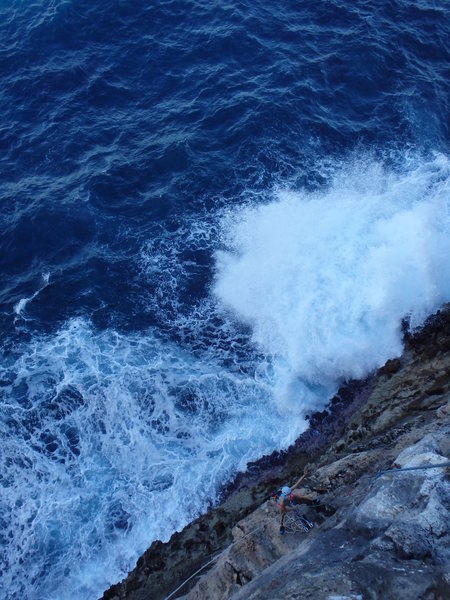 Hilary belaying as a wave crashes into the whirlpool