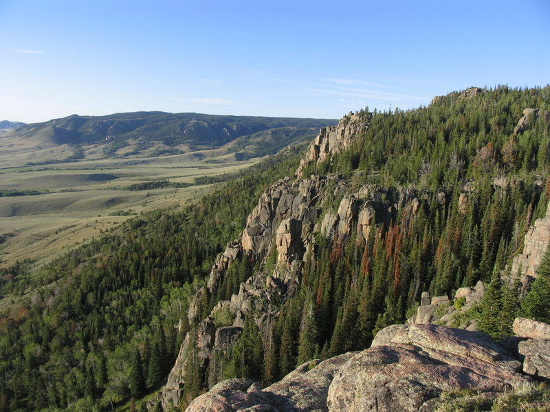 Looking at the north facing escarpment while standing on top of the east facing escarpment.  It is not as continuous of a rock band but there are some steep mounds.