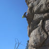 Ben surmounts the crux roof.